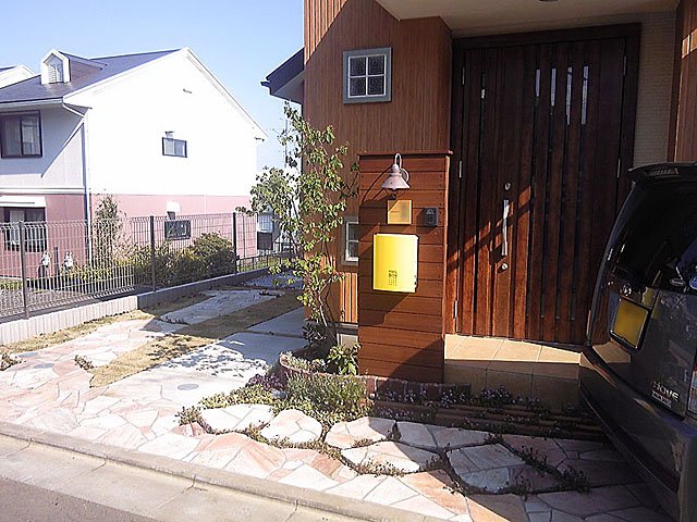 Wooden Welcome Wall Surrounded with Greenery
