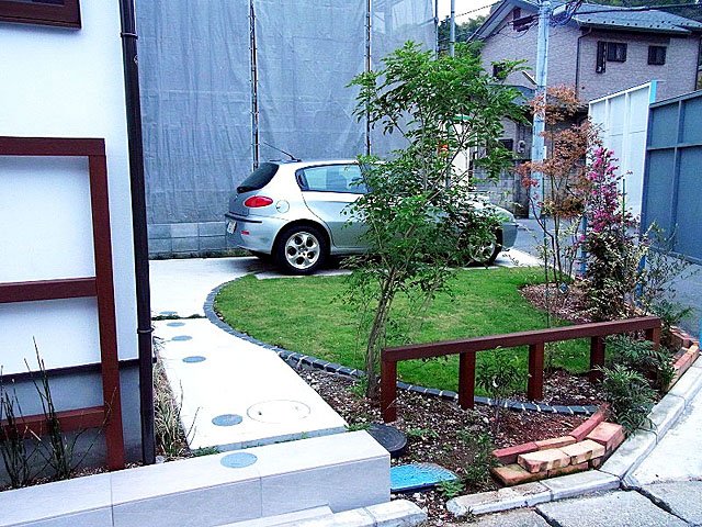 Lawn and Trees to Garden Beside Parking