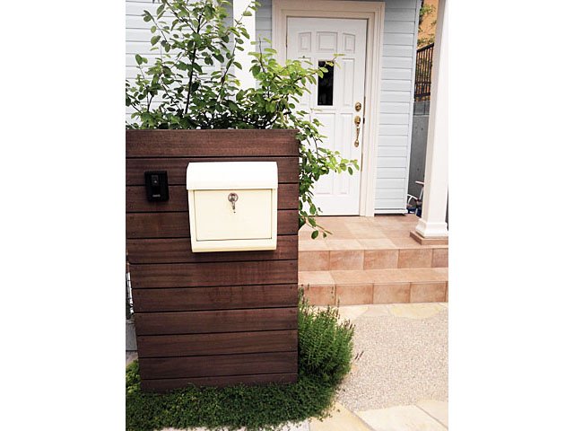 Parking with Greenery and Wooden Welcome Wall